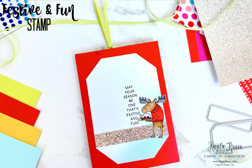 A fun card featuring a pull out slider card design and the Stampin’ Up! Festive & Fun Stamp Set coloured with Stampin' Blends to create a super fun interactive card. This picture shows the reverse side of the card where an additional countryside corner die cut was added to add an additional space to write. 