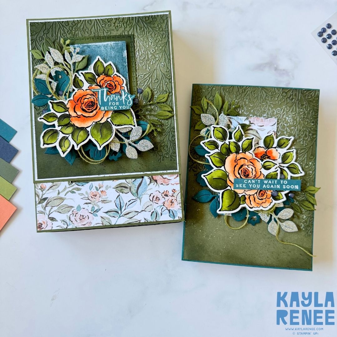 Two handmade pop-up drawer cards displayed side by side, each decorated with embossed green backgrounds and layered floral die-cuts. One card reads ‘Thanks for being you,’ and the other ‘Can’t wait to see you again soon.’ Coordinating colored paper swatches are shown to the side.
