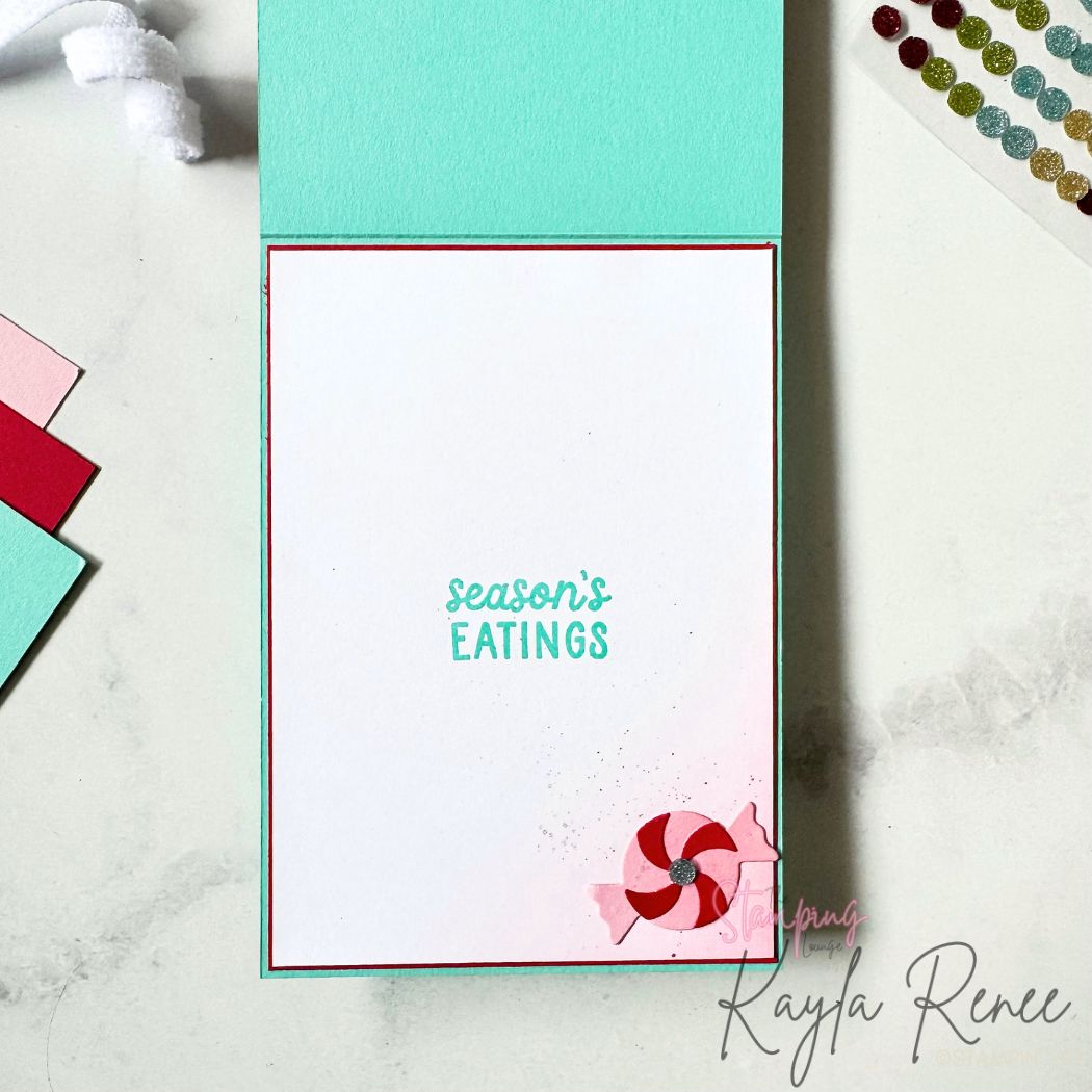 Clean and simple inside panel of the handmade holiday card stamped with “season’s EATINGS” and a small peppermint embellishment in the corner. Light ink blending adds subtle festive colour.