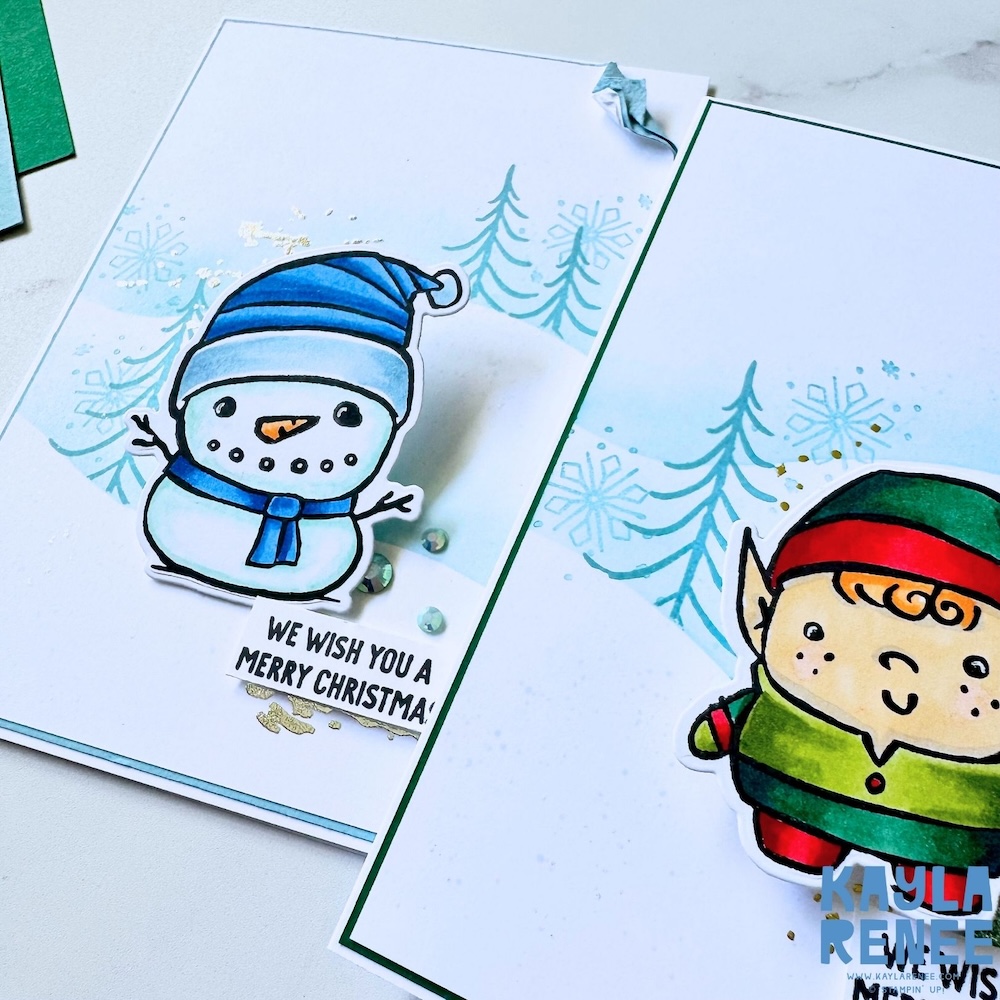Snowman and elf Christmas cards made with the Stampin’ Up! Festive Friends bundle, featuring playful characters, winter scene stamping, soft blue ink blending, and festive embellishments.