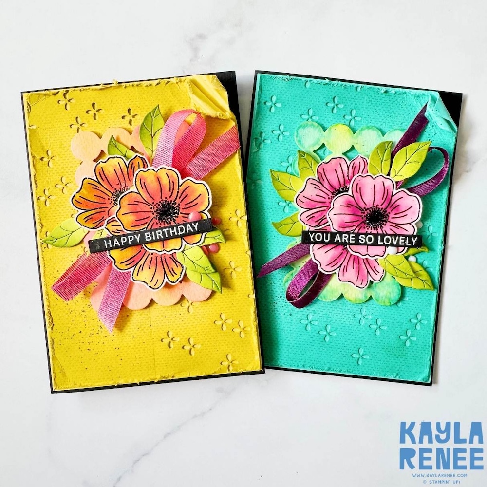 Two handmade Stampin’ Up! In Color cards featuring the Lovely Arrangements Bundle, one with a yellow textured background and orange flowers with “Happy Birthday” sentiment, and one with a teal background and pink flowers with “You Are So Lovely” sentiment.