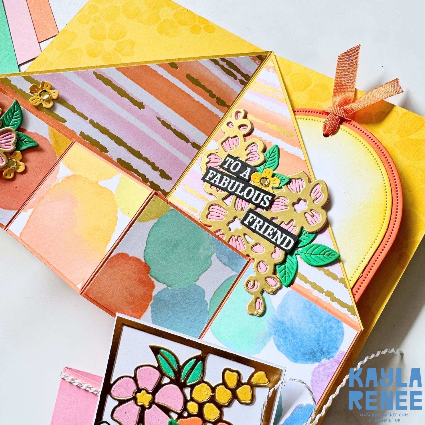 Partially opened pop out angled accordion card displaying geometric folds, soft watercolour patterns and layered floral embellishments.