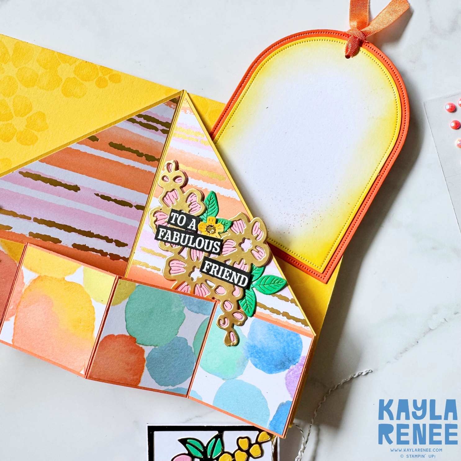 Top-down view of the fully opened angled accordion card with yellow cardstock base, pastel patterned sections and intricate Fragrant Layers die-cut flowers.