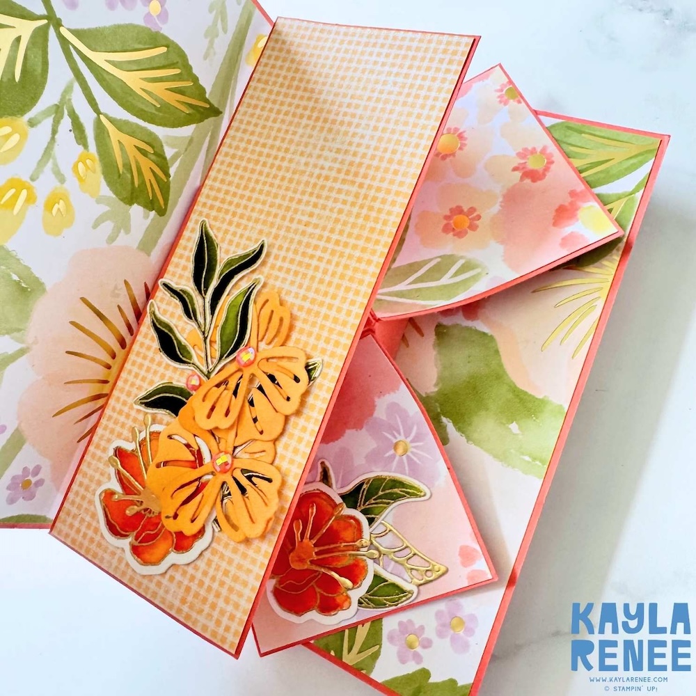 Interactive card partially opened showing swing-out panels with coordinating floral patterns and layered die-cut flower embellishments.