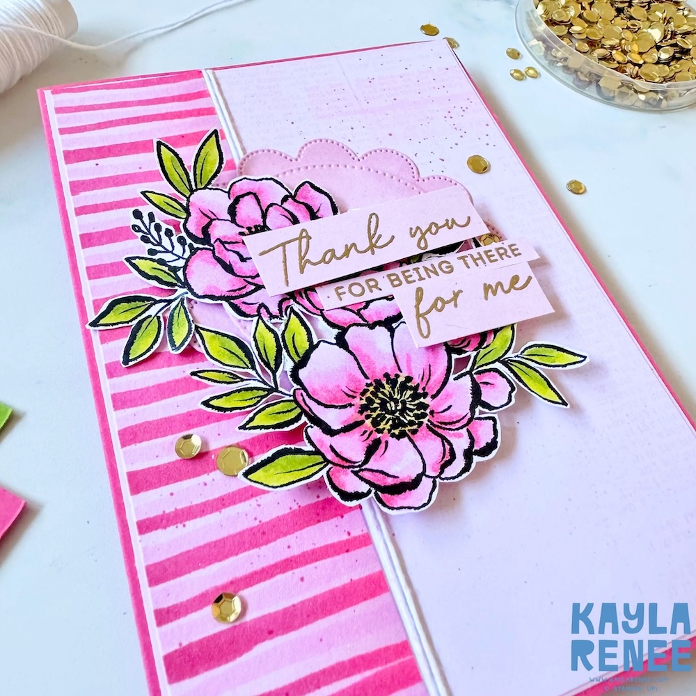 Angled view of a Stampin’ Up! Artisan Sketched Gardens Designer Series Paper card showcasing dimensional pink florals, leafy accents, gold sequins, and layered sentiment strips from the Scalloped Blooms bundle.
