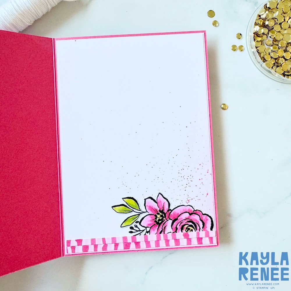 Inside of a handmade Stampin’ Up! Artisan Sketched Gardens Designer Series Paper card featuring a clean white writing panel with stamped floral detail in the corner and coordinating pink striped border.