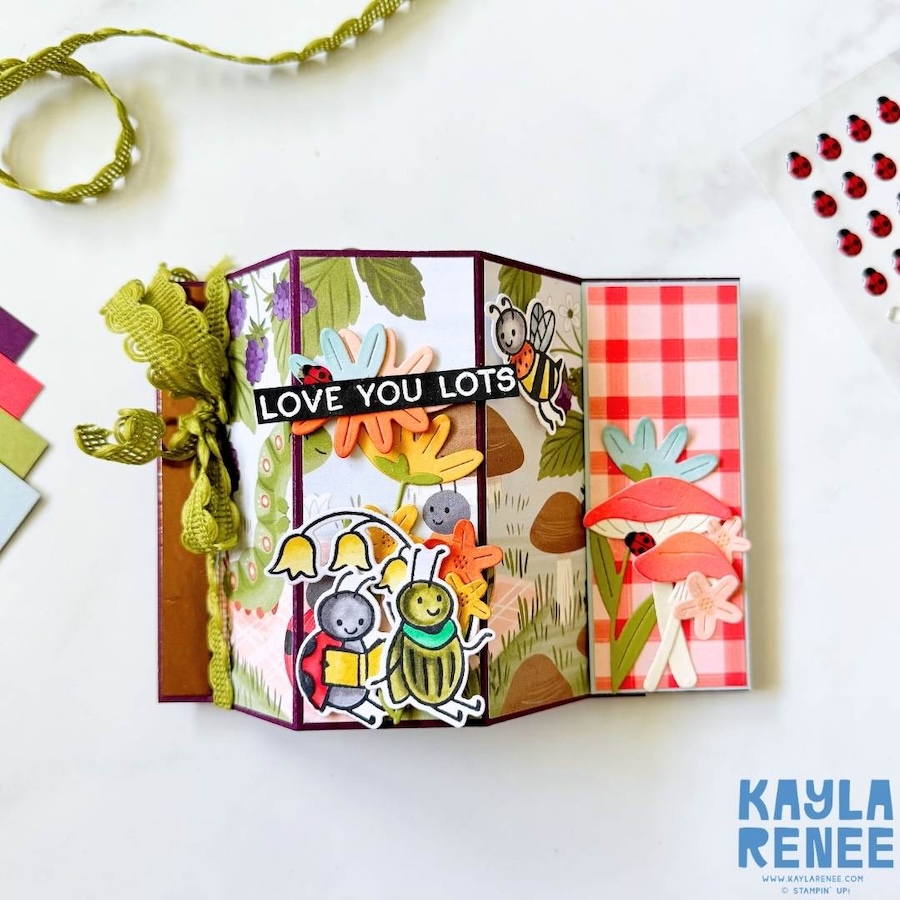 Front view of bay window fun fold card with dimensional panels, showcasing cute bug illustrations, floral accents, and patterned paper from the Cute as a Bug suite.