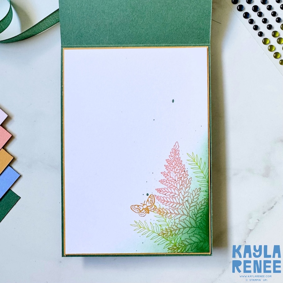 Inside of the handmade card featuring a clean white writing panel with softly blended fern stamping and a butterfly detail in coordinating 2026–2028 In Colours.