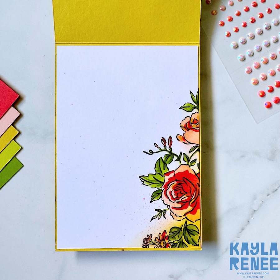 Inside view of the handmade card featuring a clean white writing panel with stamped floral images in the bottom corner, coordinating with the Layers of Beauty bundle design.