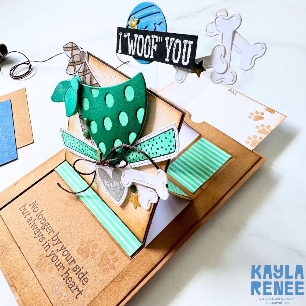 Open card displaying the pop-up feature in action, with the extended slider revealing the heartfelt message and layered dog elements.