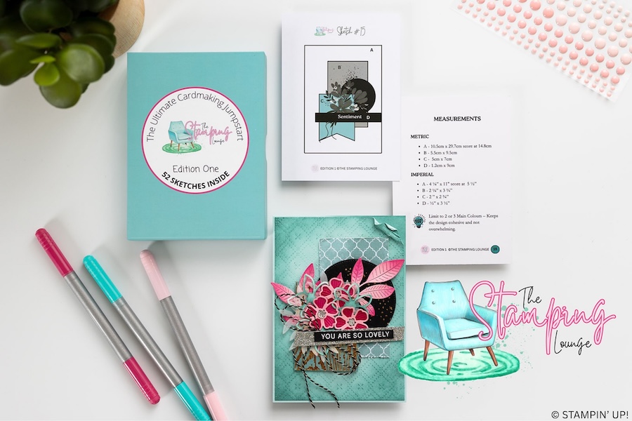 Styled flat lay showing The Stamping Lounge Sketch Box, printed sketch and measurements, and the finished handmade card alongside coordinating markers, demonstrating the sketch inspiration and completed design.