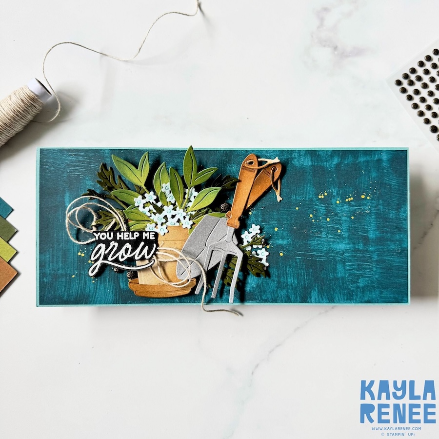 Handmade alternating pop-up panel fun fold card made using the Stampin’ Up! Nature Walk Designer Series Paper and Help Me Grow Stamp & Die Bundle, featuring a rich blue textured background, layered garden pot arrangement, foliage, gardening tools, and rustic twine accents.