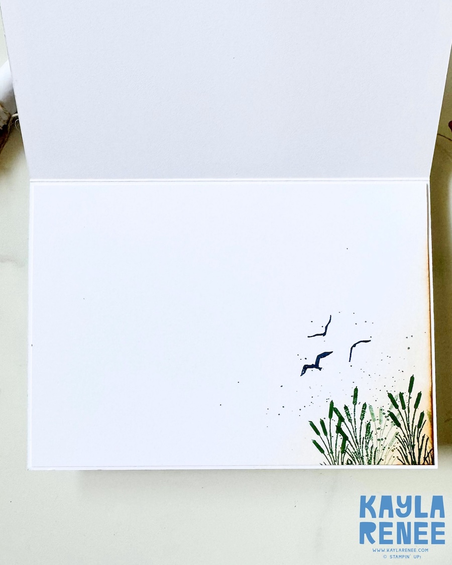 Inside view of a handmade card created with the Stampin’ Up! Lakeside Retreat Paper Pumpkin Kit, featuring stamped reeds, flying birds, soft ink splatter details, and plenty of space for a handwritten message.