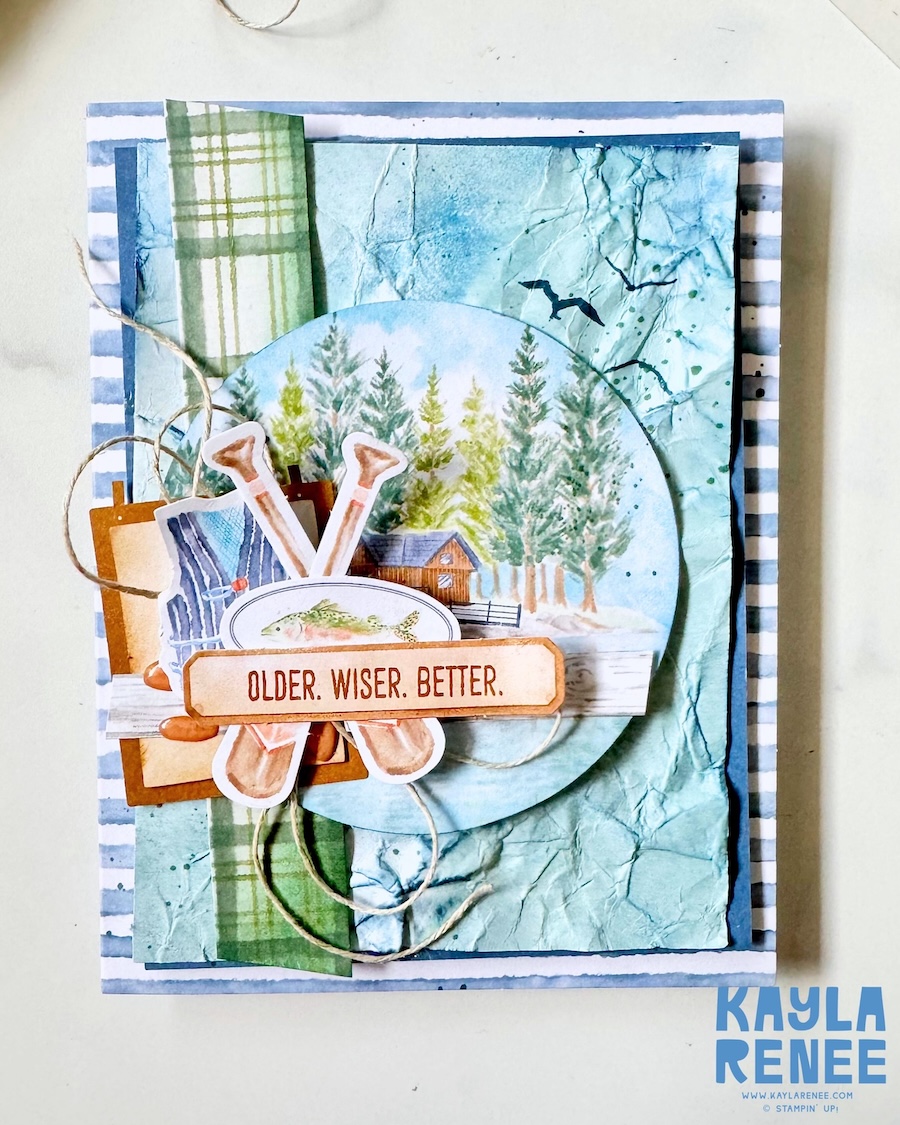 Handmade masculine card created as an alternative project using the Stampin’ Up! Lakeside Retreat Paper Pumpkin Kit, featuring layered fishing and cabin elements, crossed paddles, rustic textures, plaid patterns, and the sentiment “Older. Wiser. Better.”