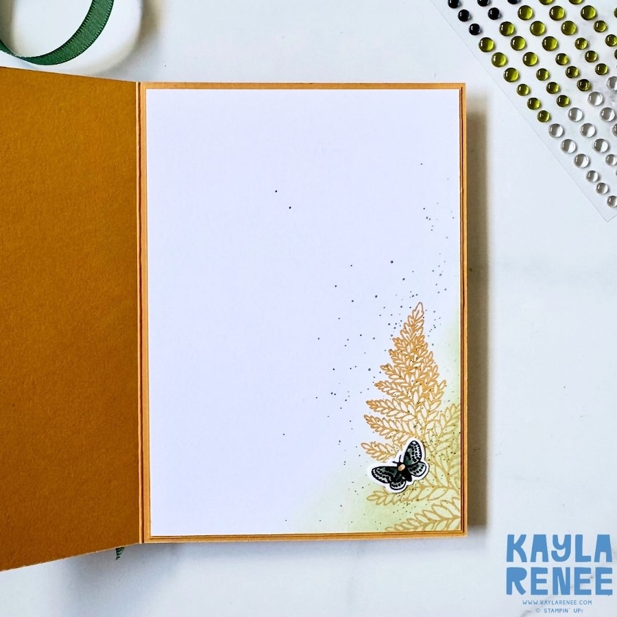 Inside view of a handmade card created for Global Design Project #GDP548 using the Stampin’ Up! Moonlit Flora Suite and the new Stampin’ Up! In Colours Golden Glow and Peaceful Pine, featuring stamped fern details, ink splatter effects, and a small moth embellishment in the corner.