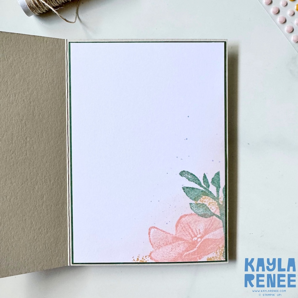 Inside view of a handmade Stampin’ Up! In Colors floral card featuring a clean white writing panel with soft stamped floral details in the corner and subtle ink splatter accents.