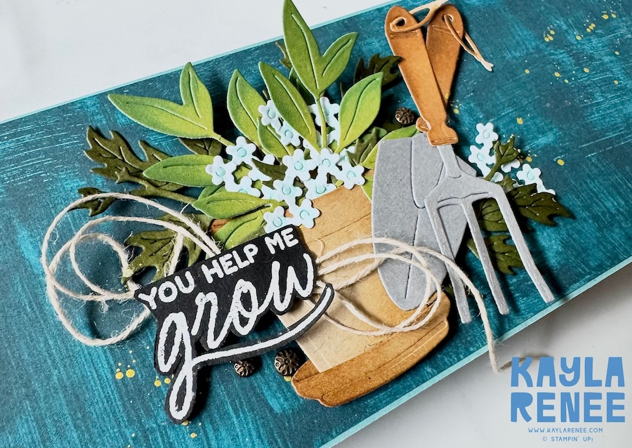 Close-up of a handmade alternating pop-up panel fun fold card created with the Stampin’ Up! Nature Walk Designer Series Paper and Help Me Grow Stamp & Die Bundle, featuring layered greenery, white florals, gardening tools, twine details, and the sentiment “You Help Me Grow.”