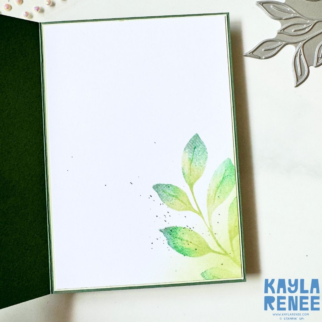 Inside view of a handmade Stampin’Up! Botanical Glow card featuring softly stamped botanical leaves in shades of green with subtle ink blending and delicate ink splatter. The clean layout leaves plenty of space for a personal message while coordinating beautifully with the elegant hot foiled botanical design on the card front.