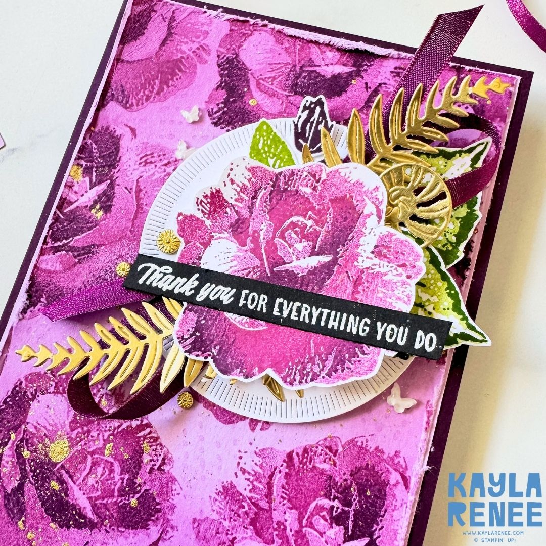 Close-up of a handmade Stampin’ Up! Begonia Belle floral card featuring a large layered pink and purple rose, green leaves, gold foliage, burgundy ribbon and a white circular die-cut layer. The sentiment reads “Thank you for everything you do.”