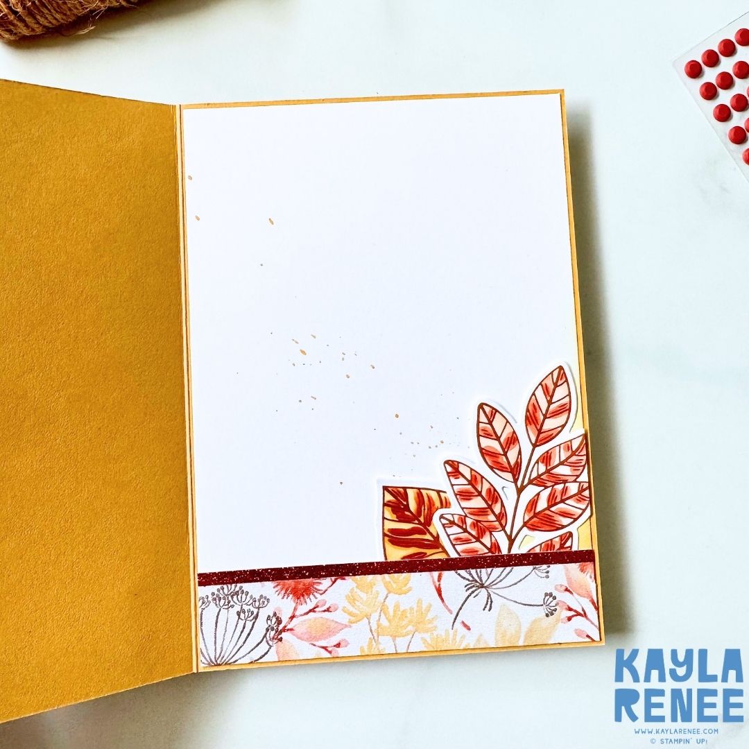 Inside of an autumn-themed handmade card with a white writing panel, coordinating Glow of Harvest Designer Series Paper along the bottom and a cluster of copper-foiled leafy elements in the lower corner.
