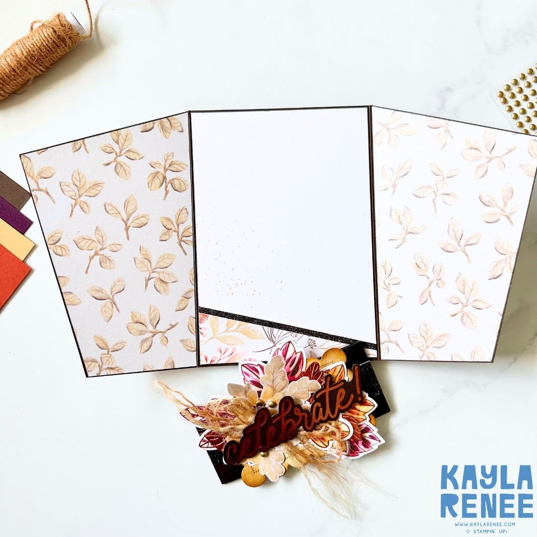 Inside view of an angled gatefold card showing coordinating Glow of Harvest Designer Series Paper on both folded panels, a blank white centre panel for writing and the decorated “Celebrate!” card front visible at the bottom.