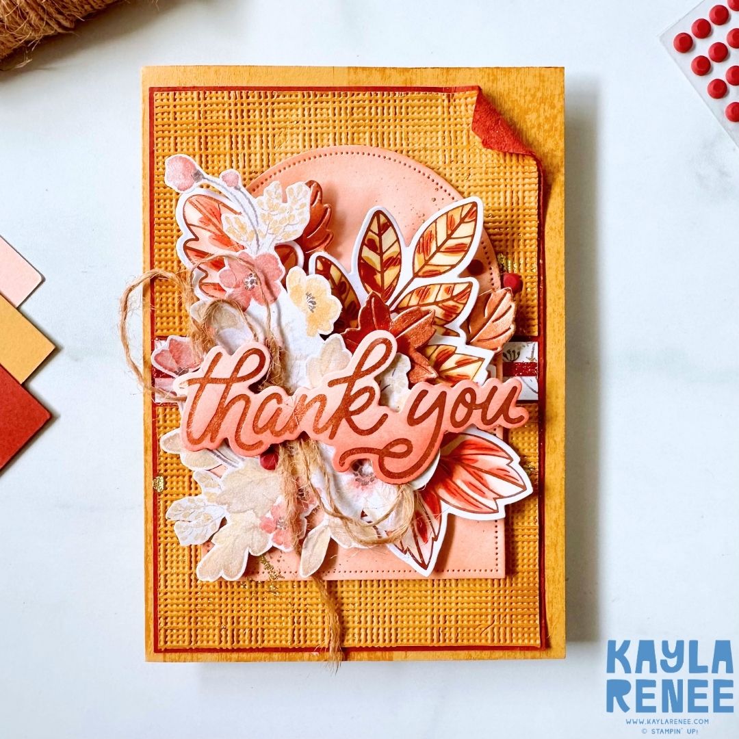 Handmade autumn-themed card featuring layered floral and leafy elements in warm orange, peach and cream tones, with copper-toned hot foil details and a large “Thank you” sentiment. Created using Stampin’ Up! Lustrous Leaves Hot Foil Dies and Glow of Harvest Specialty Designer Series Paper.