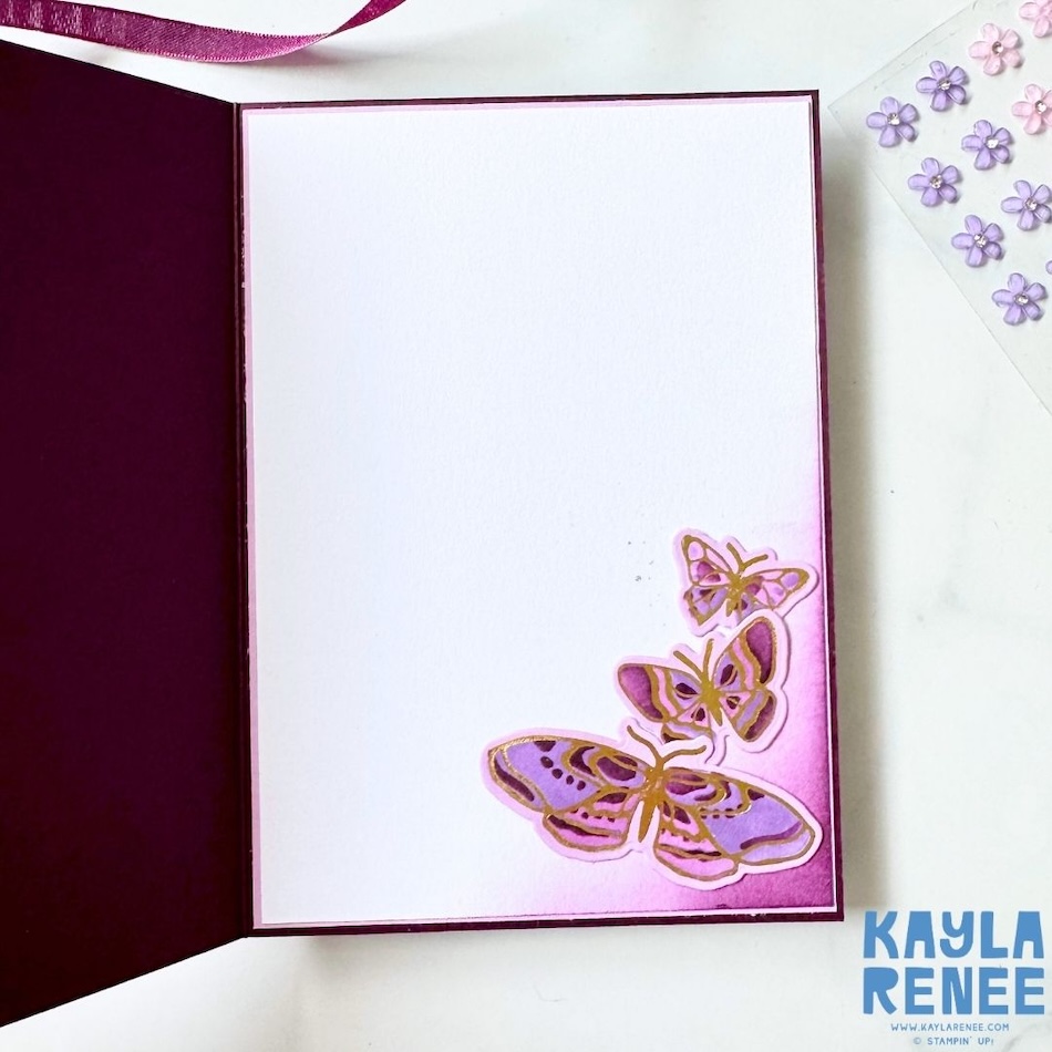 Inside of a handmade Stampin’ Up! hot foil butterfly card featuring a large white writing panel bordered in purple. Three smaller butterflies with purple and gold foil details decorate the lower right corner, with soft purple ink blending behind them to coordinate with the card front created using the Butterfly Flight and Garden Silhouette hot foil dies.