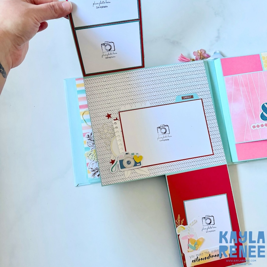 Interactive scrapbook page with multiple layered photo mats and decorative elements, including butterflies, flowers, hearts and labels, demonstrating the variety of photo and journaling spaces within the mini album.